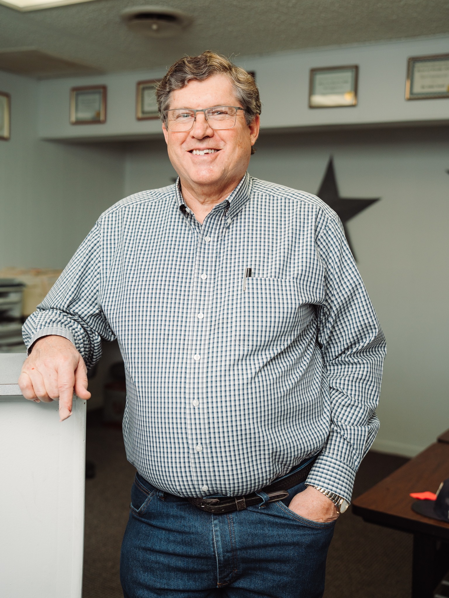 Dr. Jerry C. Nance, D.C. — chiropractor at Nance Chiropractic Clinic in Stephenville, TX, with credentials on the wall behind him